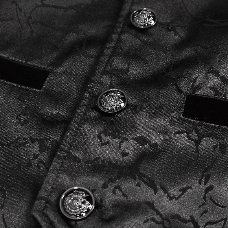 Embossed metal button and pocket detail of gothic tailcoat, top-down close-up view showing craftsmanship
