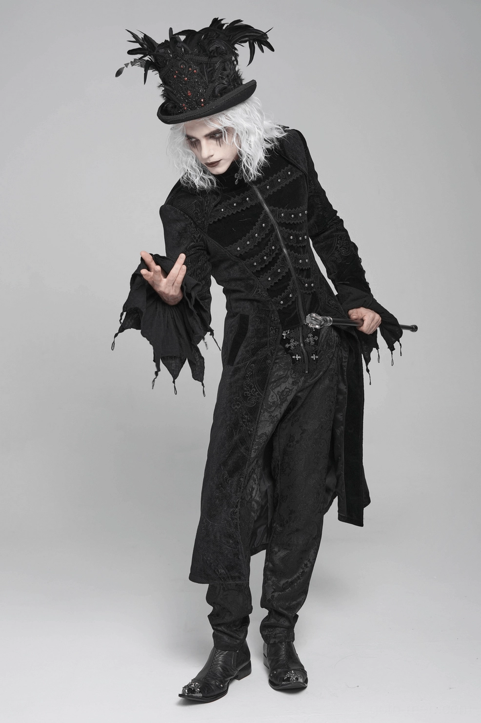 Black gothic tailcoat on model showing fitted waist, extended flared hem, and overall theatrical presence for goth events