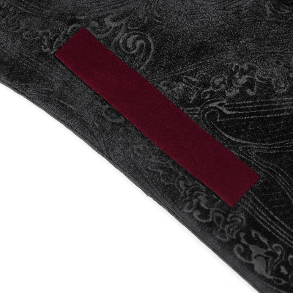 Full-length flat display of black Victorian gothic tailcoat with wine red accents showing complete silhouette and dramatic flared hem construction