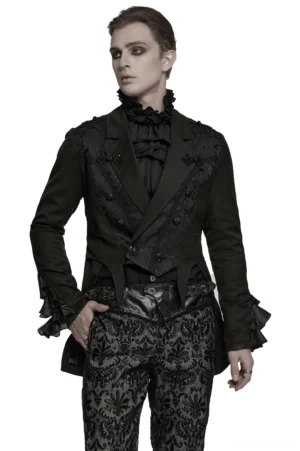 Black gothic tailcoat jacket with jacquard embroidery, peaked lapels, and ruffled cuffs shown in front three-quarter view on male model