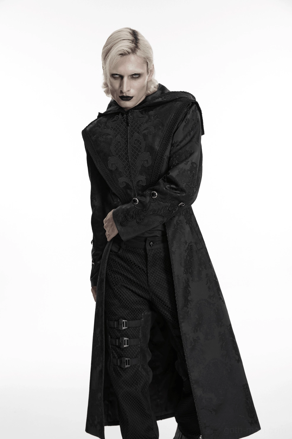 Gothic hooded tailcoat displaying intricate jacquard weave pattern and embroidered ornamental design