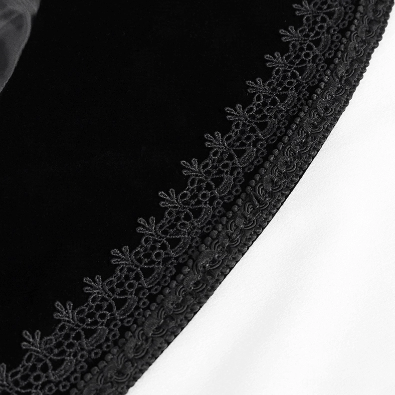 Gothic tailcoat edge trim detail, close-up of black lace and velvet fabric border construction