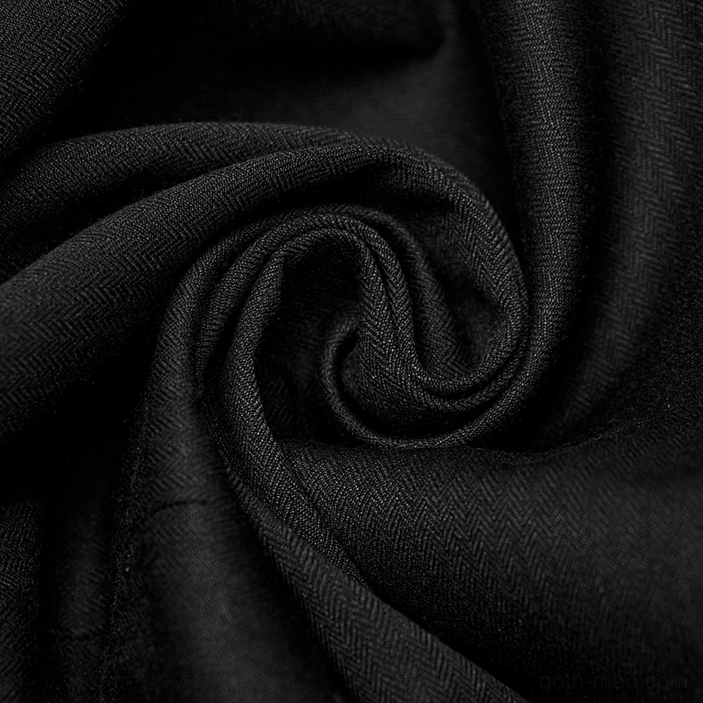 Black gothic tailcoat layered construction detail showing ruffled cuff and fabric texture combination