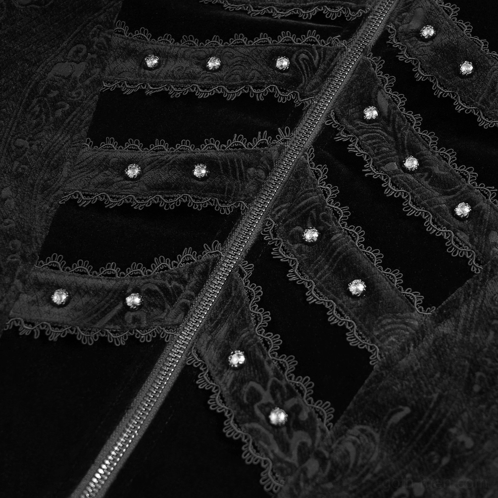 Black gothic tailcoat decoration close-up showing lace trim, metal studs, and central metal zipper on velvet fabric