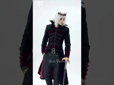 Medium front shot of male model wearing black and wine red gothic tailcoat with crown and white wig, holding decorative walking cane