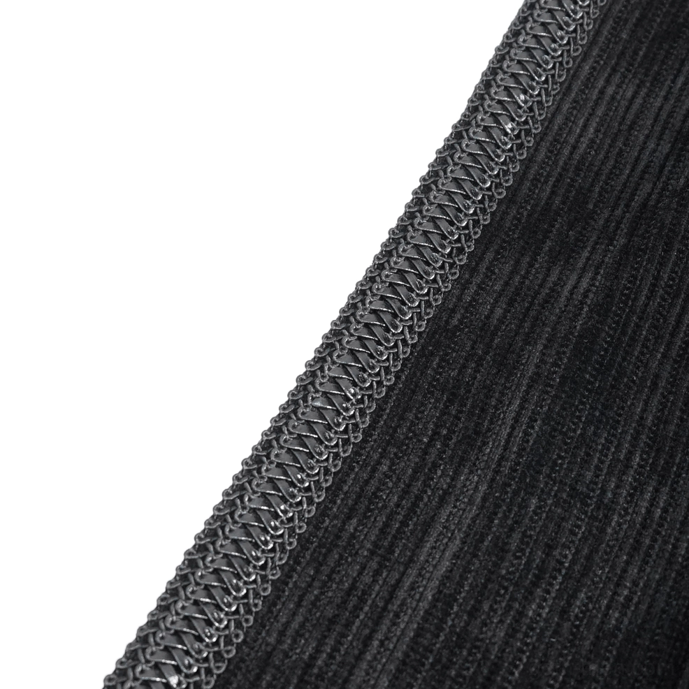 Ribbed corduroy velvet fabric texture with silver chain trim detail close-up
