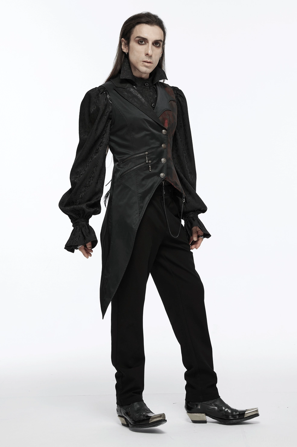 Close-up view of black gothic tailcoat vest showing metal brooch accents, chain decorations, and brocade fabric texture