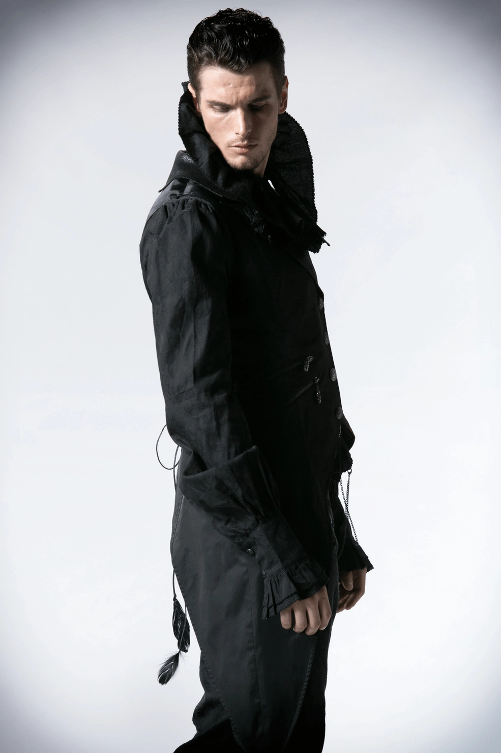 Black gothic tailcoat vest front view showcasing metal chain details, structured fit, and dramatic asymmetric silhouette