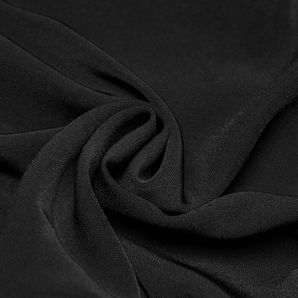 Full-length side view of black gothic tailored trousers emphasizing slim-fit silhouette