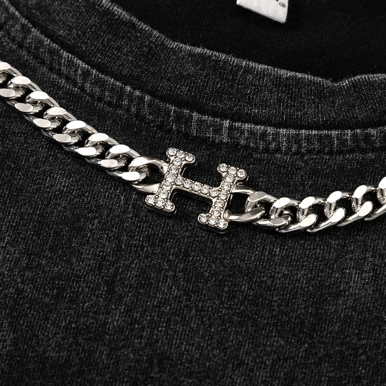 Back neckline of distressed gothic tank top showing plain crew neck and washed black fabric