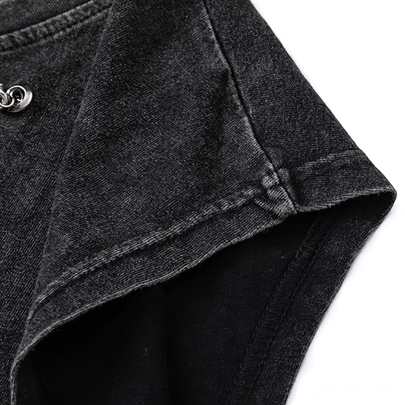 Bottom hem of gothic tank top showing intentional frayed and ripped distressed edge