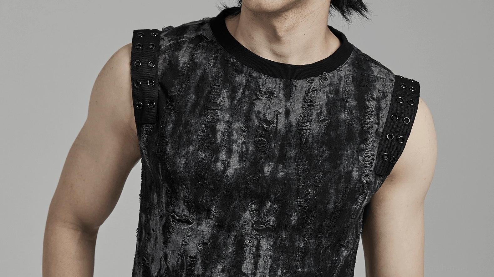 Close-up of distressed eyelet shoulder tank - studded webbing detail on model