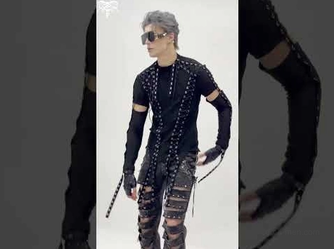 Gothic mesh tank styled with ripped pants and fingerless gloves - side profile on model