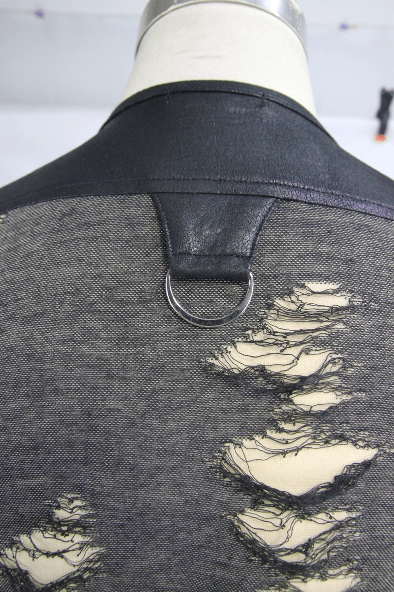 Gothic distressed tank top on model demonstrating slim fit silhouette and crisscross lace neckline styling