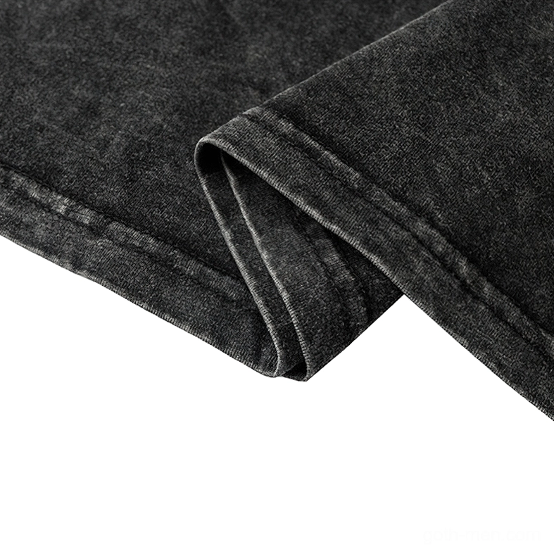 Gothic tee bottom hem detail, double-stitched black washed cotton fabric fold