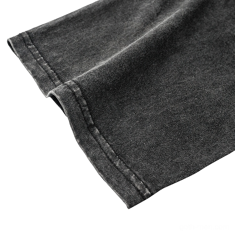 Short sleeve hem detail of gothic cotton tee, finished edge close-up