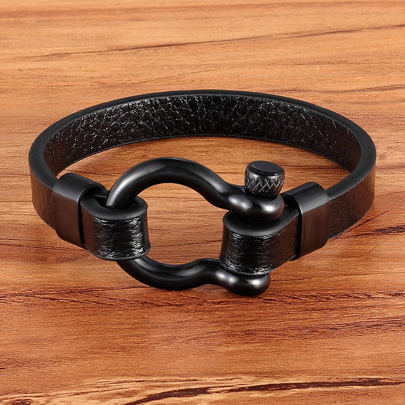 All-black matte finish gothic toggle leather bracelet on wooden surface - authentic darkness aesthetic