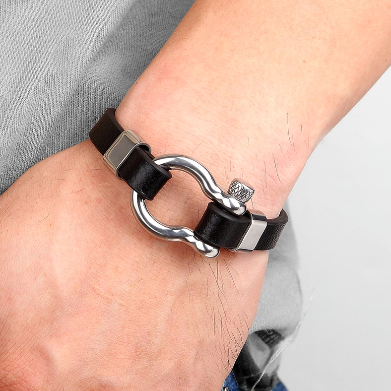 Man wearing silver and black gothic circle toggle bracelet - modern dark fashion styling on male wrist
