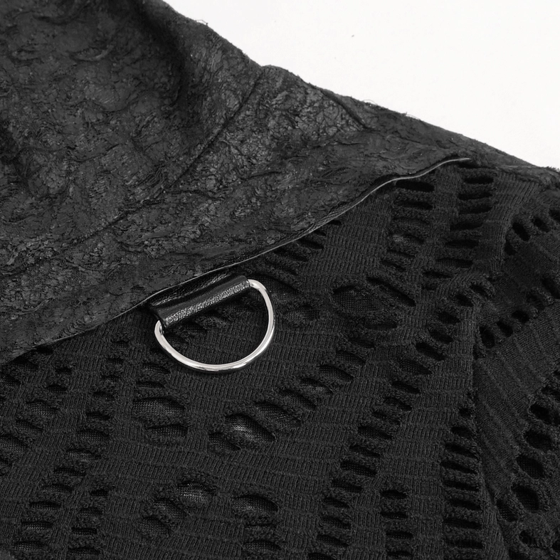 Extreme close-up of gothic top fabric detail featuring distressed texture, mesh cutout pattern, and metal D-ring hardware
