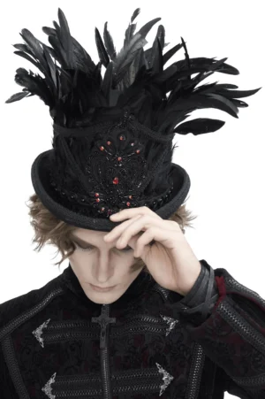 Gothic black feathered top hat with red jewel embroidery, front view on male model showing feather plume and embroidered details
