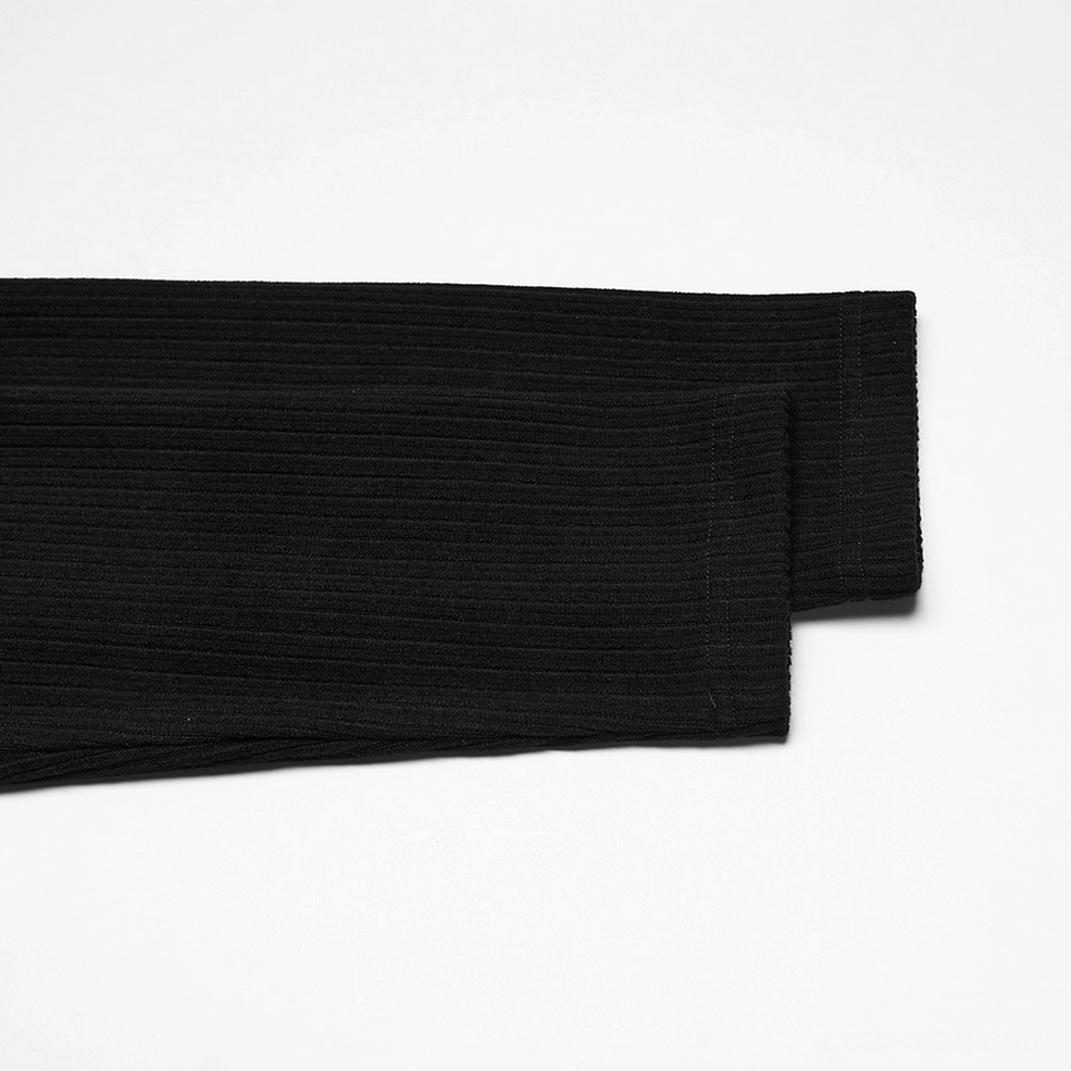 Sleeve detail of black gothic mock neck top showing solid ribbed knit fabric texture