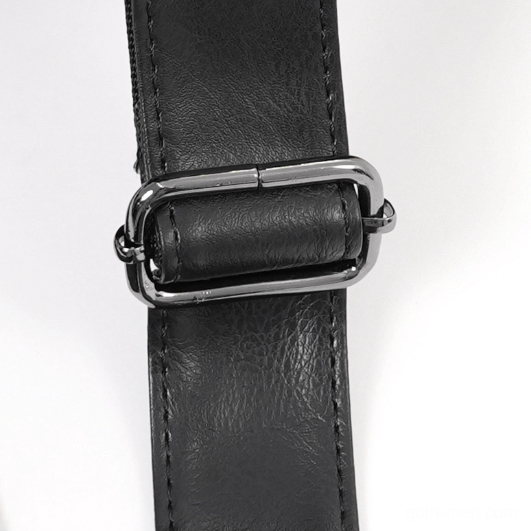 Close-up of adjustable black faux leather shoulder strap with metal adjustment buckle and reinforced stitching detail