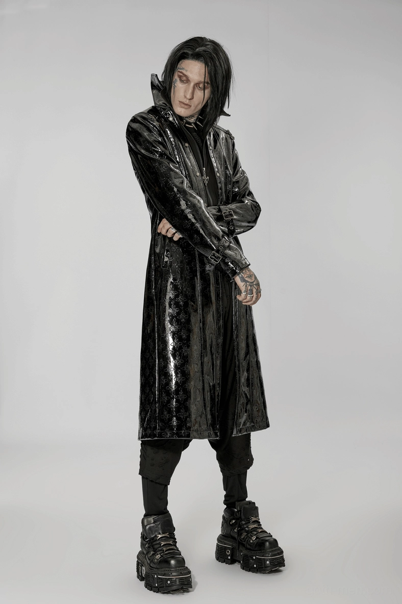 Gothic trench coat detail showing embossed cross texture, fitted tailoring, and patent leather construction quality