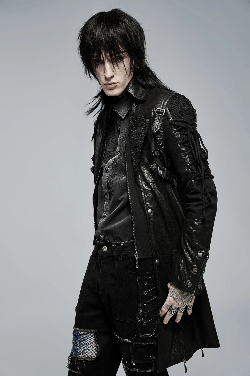 Black gothic trench coat length and hem detail with zipper accents on sides