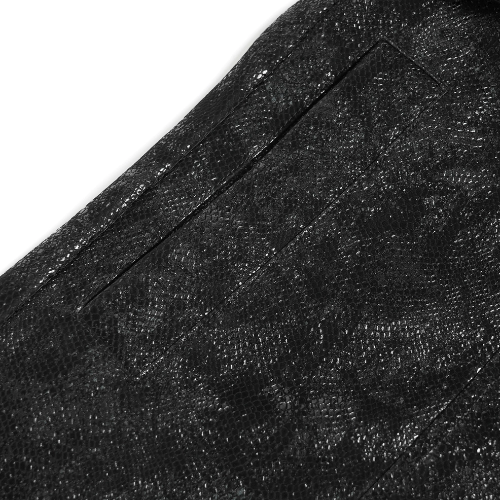 Side profile of gothic faux fur coat showing architectural silhouette, buckle accents and fitted waist definition