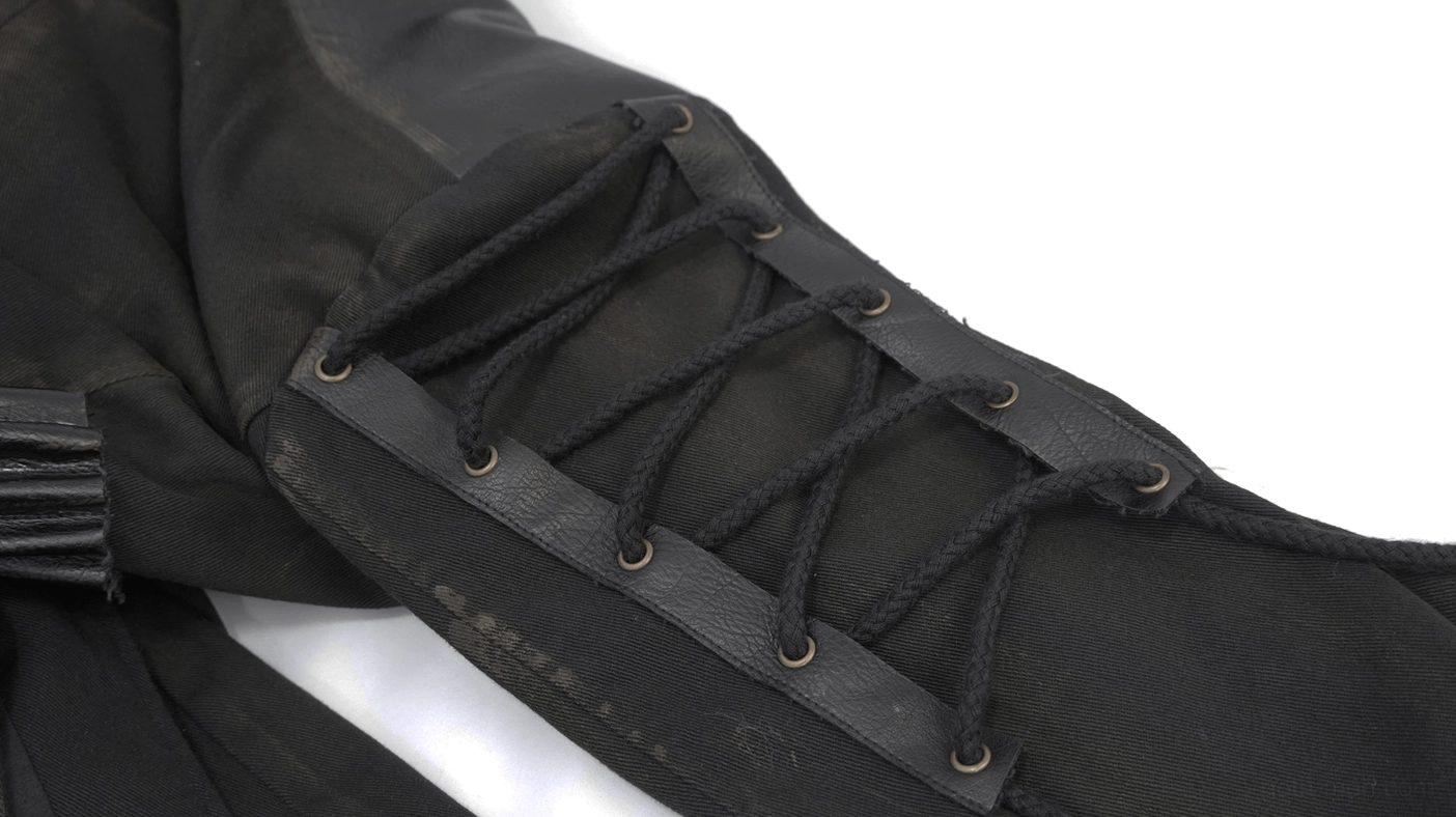 Close-up sleeve detail of gothic trench coat showing black cord lacing and metal eyelet fasteners