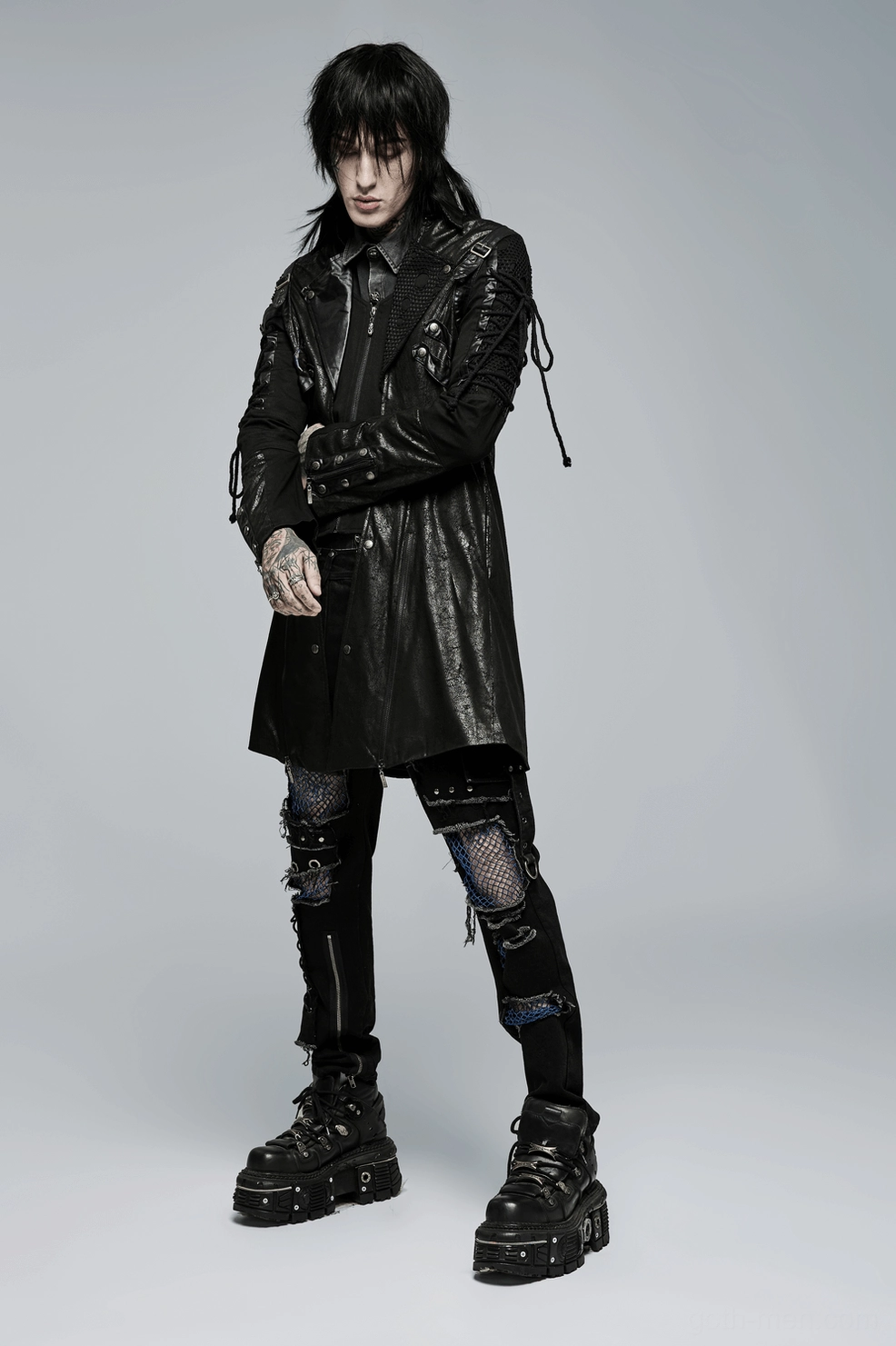 Gothic lace-up trench coat worn styling showing complete silhouette on alternative fashion model