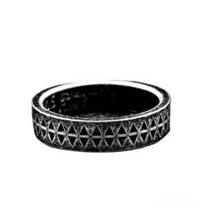 Top-down view of gothic embossed stainless steel triangle ring showing full pattern wrap