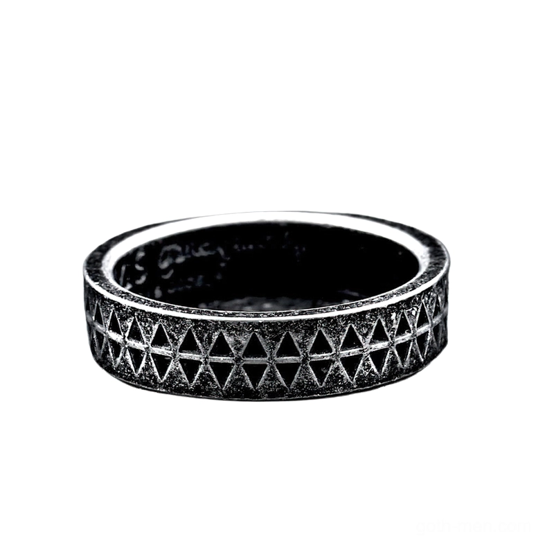 Top-down view of gothic embossed stainless steel triangle ring showing full pattern wrap