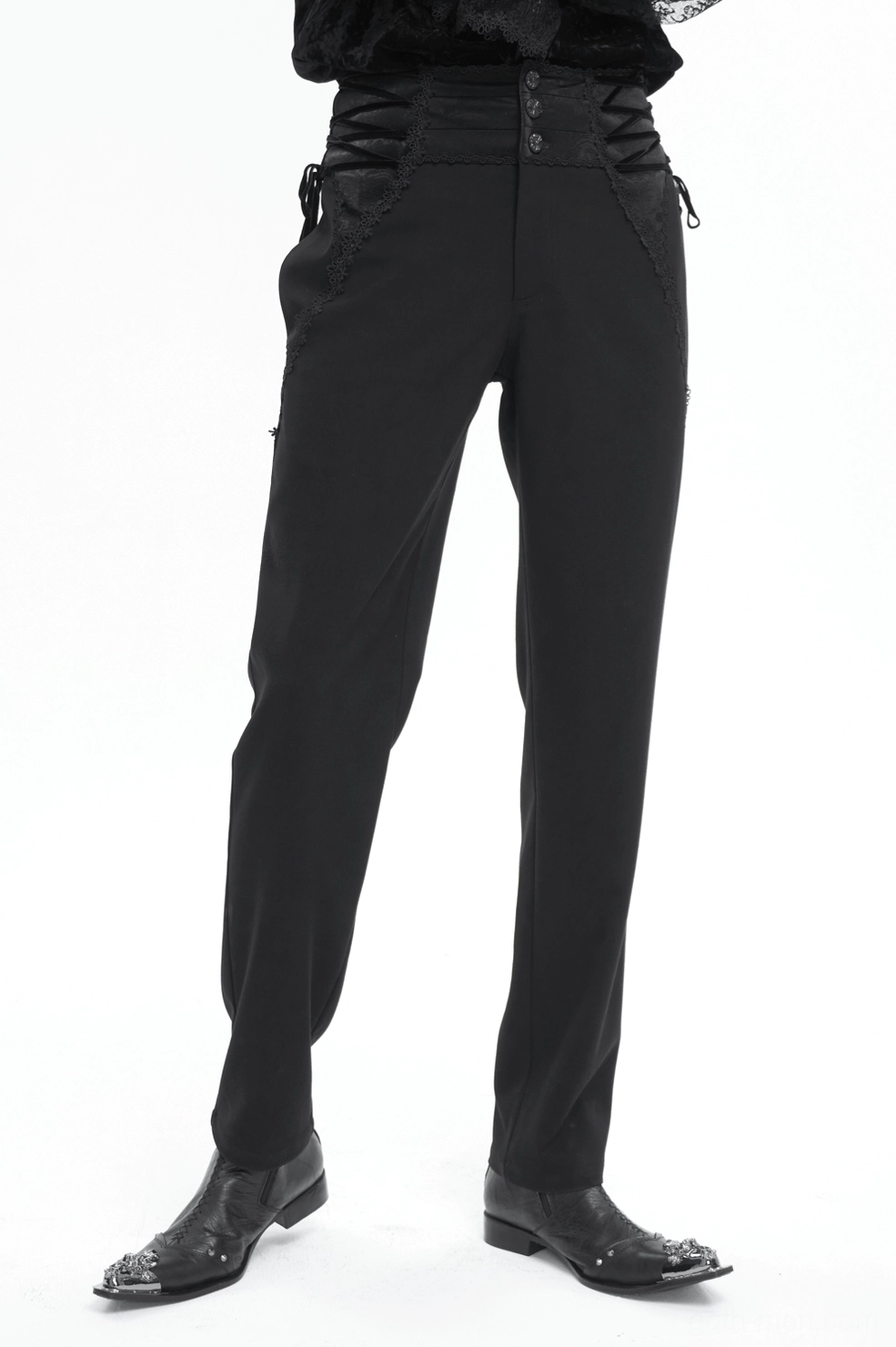 Black gothic trousers architectural detail shot emphasizing tailored construction and embellished waist closure
