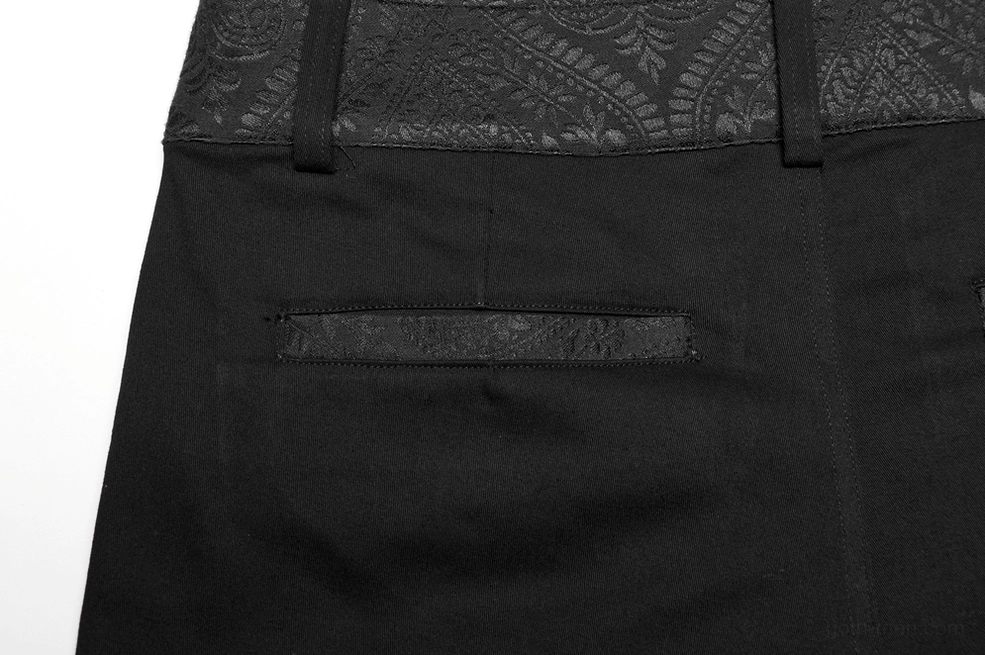 Close-up detail of back welt pocket with jacquard flap texture on black gothic slim-fit trousers