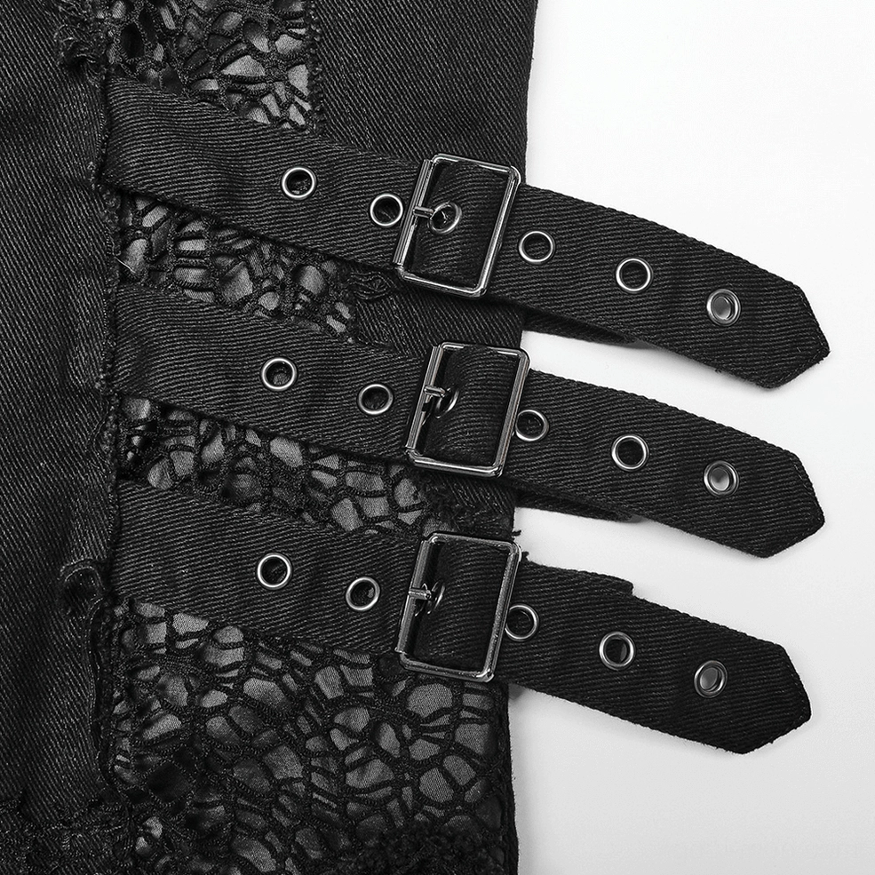 Close-up of multi-layer leather buckle hardware on gothic trousers