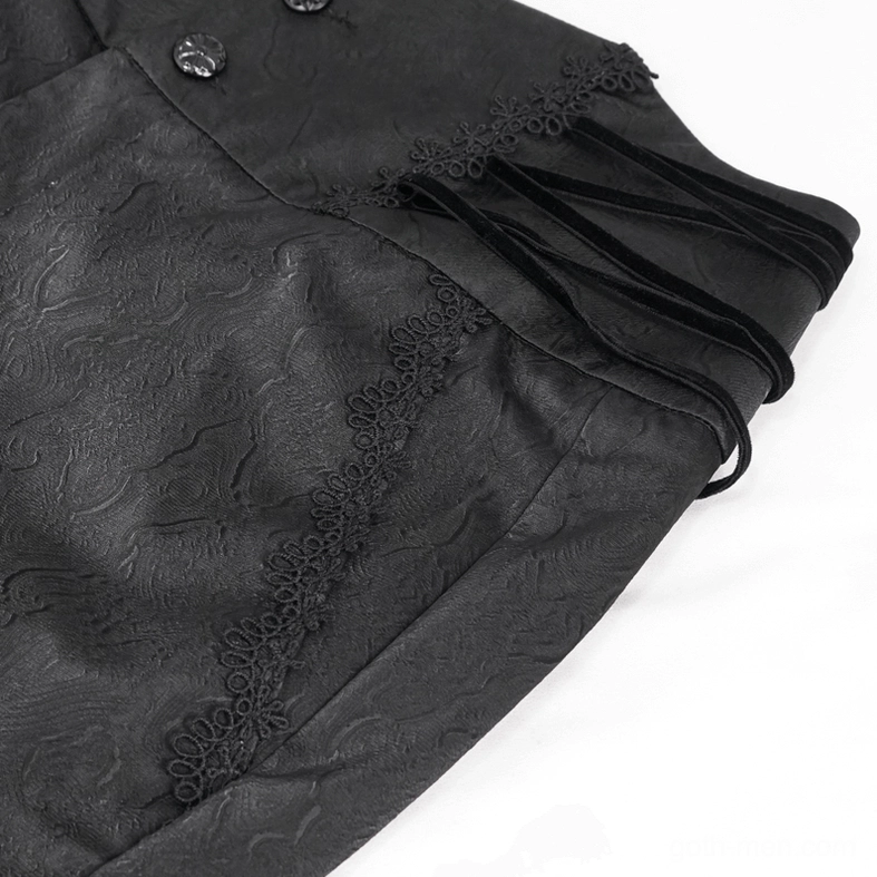 Carved floral button detail on black gothic trousers waistband with jacquard fabric