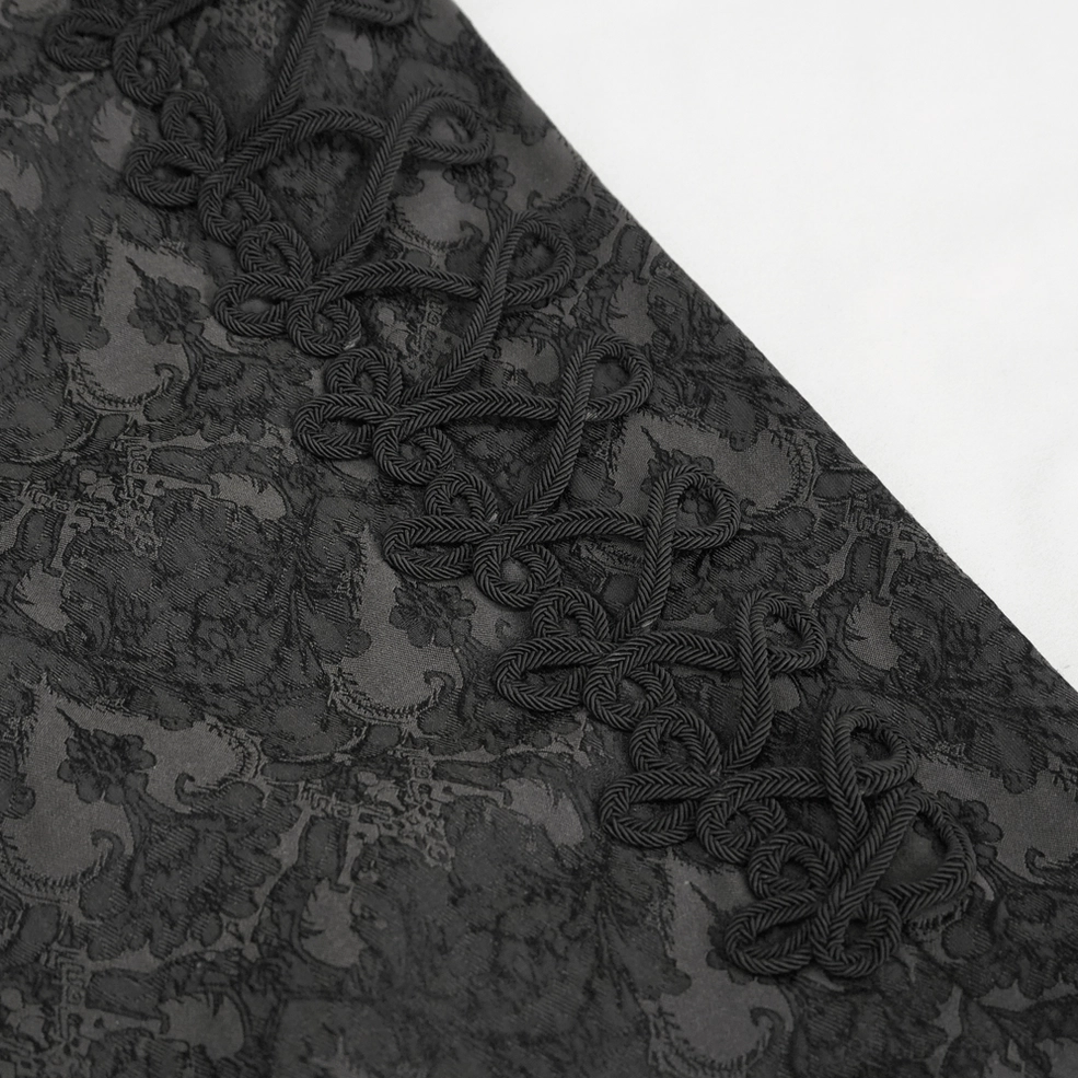 Close-up side view of braided rope lace-up trim and dark jacquard pattern gothic trousers details