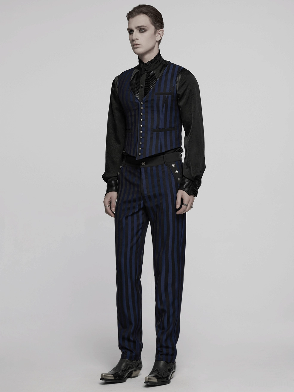 Close-up detail of black-blue gothic trousers front pocket metal buckle and engraved hardware finish