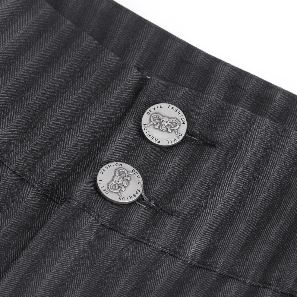 Close-up detail of branded double-button waistband on black pinstriped gothic trousers