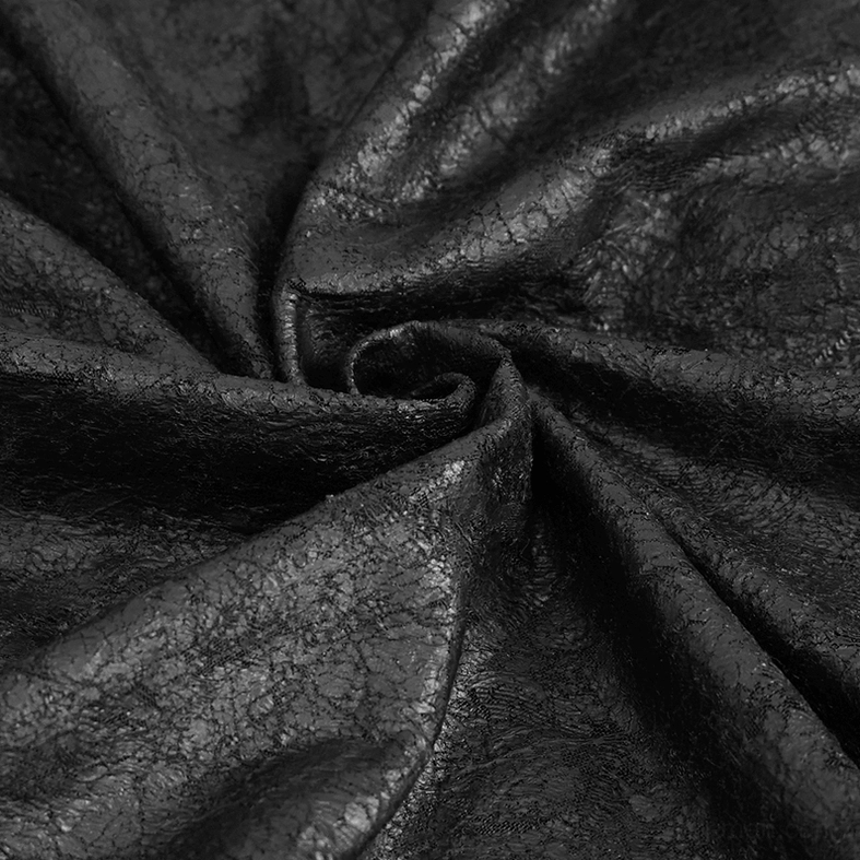 Textile close-up of cracked black fabric texture on gothic t-shirt showing surface detail and drape quality