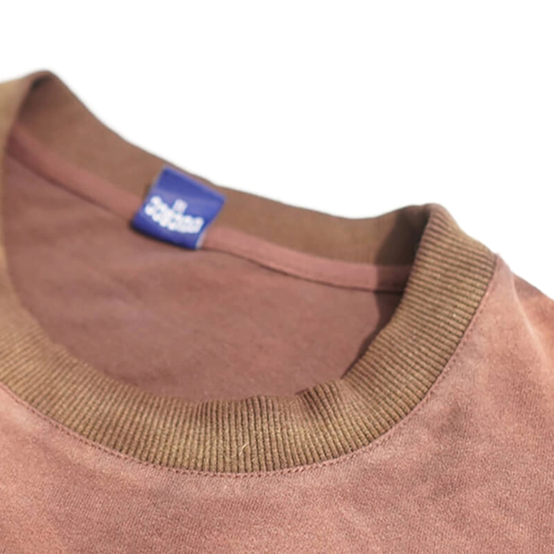 Close-up detail of ribbed O-neck crew neckline on reddish brown distressed gothic T-shirt with brand tag