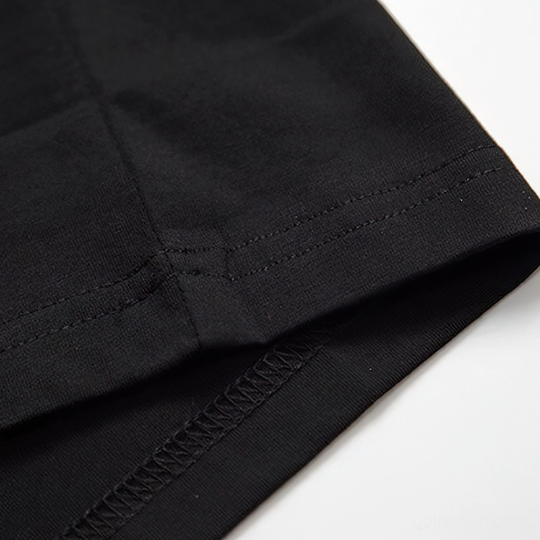 Sleeve and hem seams close-up, reinforced stitching detail of black gothic t-shirt construction