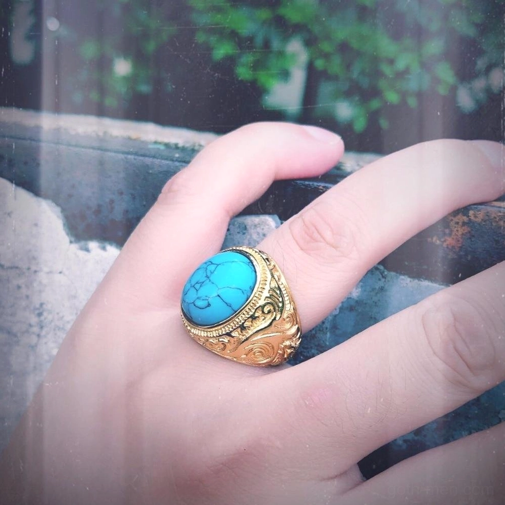 Gothic turquoise bezel ring on hand, carved band detail, vintage gothic aesthetic
