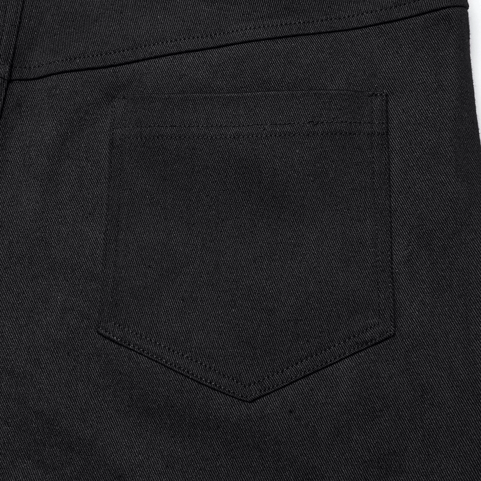 Black gothic twill pants product shot showing full silhouette and textured PU leather accents