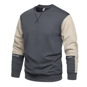 Men's dark gray and light beige patchwork sweatshirt with ribbed trims, front three-quarter studio showcase angle