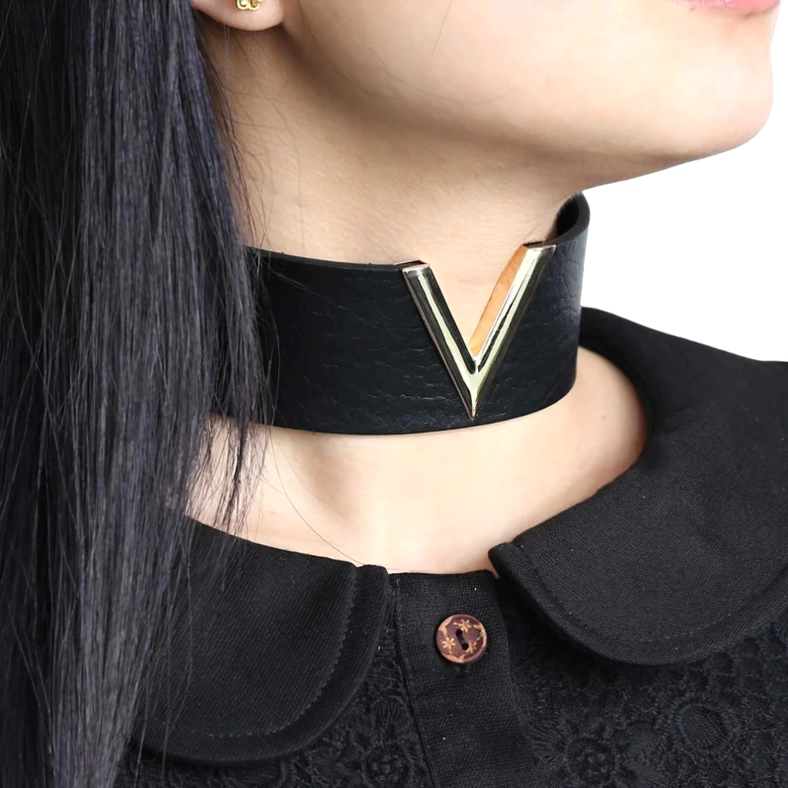 Model wearing black leather V-choker with gold accent - gothic choker styling on neck