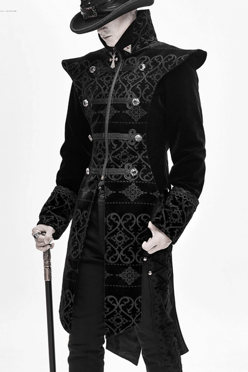 Black gothic velvet coat embossed embroidery pattern close-up showing textural gothic design elements