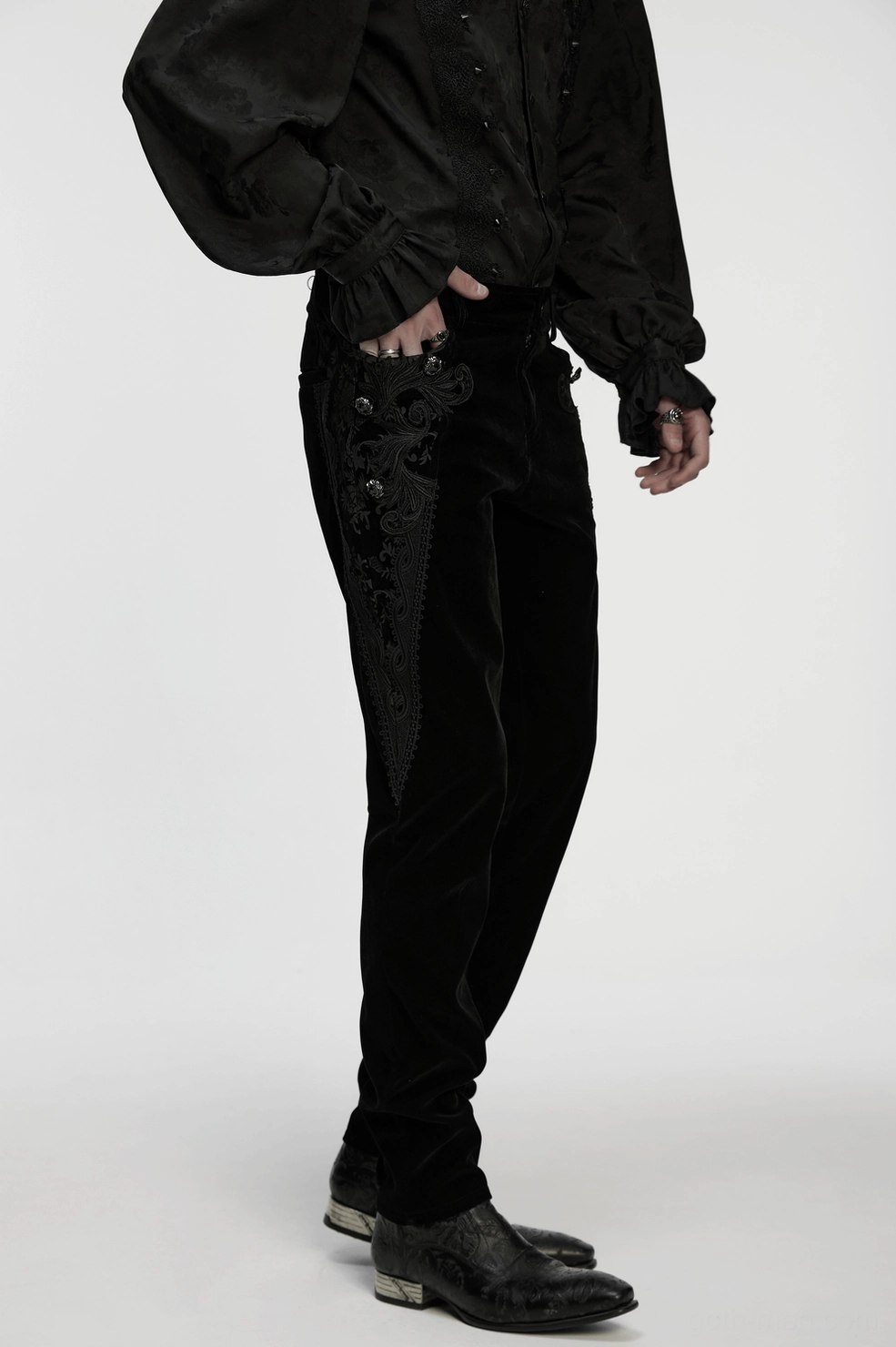 Black velvet gothic pants styling photograph showing alternative fashion aesthetic and garment drape