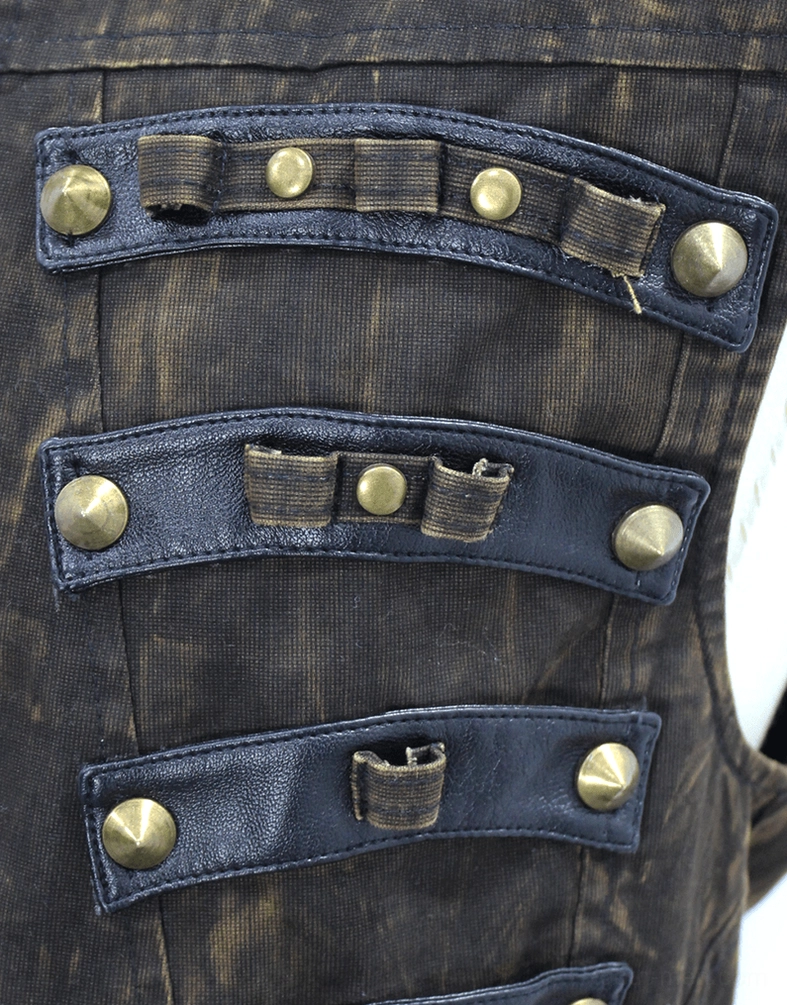 Close-up detail of brass studs and bullet shell ornament decorations on gothic waistcoat